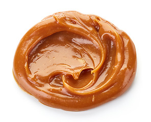 Image showing melted caramel on white background