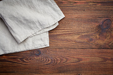 Image showing linen napkin on wooden table