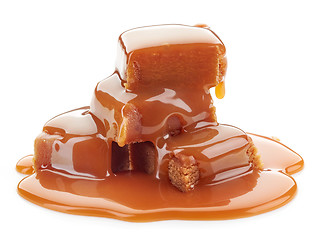 Image showing caramel candies and sauce