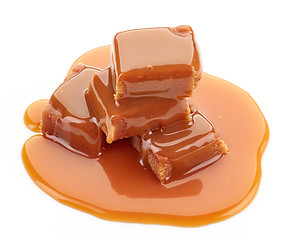 Image showing caramel candies and sauce