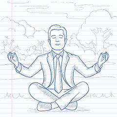 Image showing Businessman meditating in lotus pose.