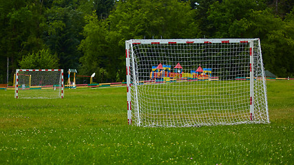 Image showing view of a net on vacant soccer pitch.