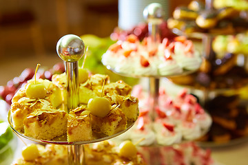 Image showing Dessert table for party. akes and sweetness. Shallow dof