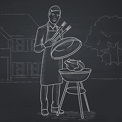 Image showing Man preparing barbecue.