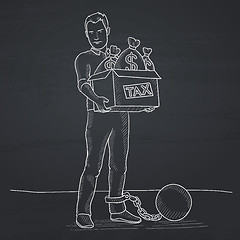 Image showing Chained man with bags full of taxes. 