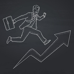 Image showing Man running on arrow going upwards.