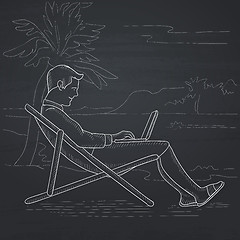 Image showing Businessman sitting in chaise lounge with laptop.