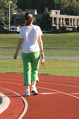 Image showing woman walking on track