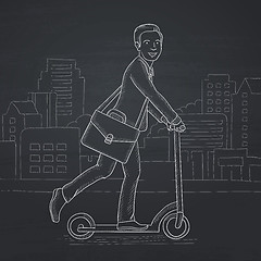 Image showing Man riding on scooter.