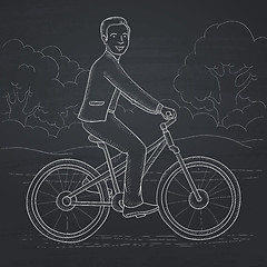 Image showing Man riding bicycle.