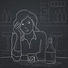 Image showing Woman sitting at bar.