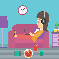 Image showing Woman lying on sofa with many gadgets.