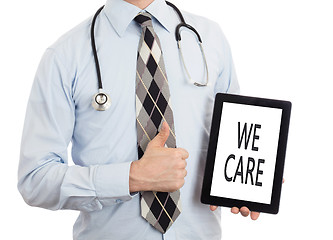 Image showing Doctor holding tablet - We care