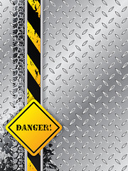 Image showing Abstract industrial background with tire tracks with danger text