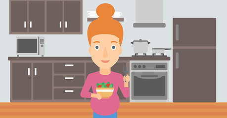 Image showing Pregnant woman eating salad.