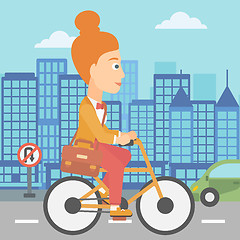 Image showing Woman cycling to work.