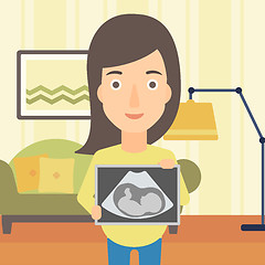 Image showing Pregnant woman with ultrasound image.