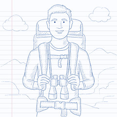 Image showing Cheerful backpacker with binoculars.