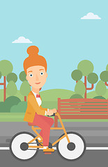 Image showing Woman riding bicycle.