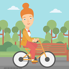 Image showing Woman riding bicycle.