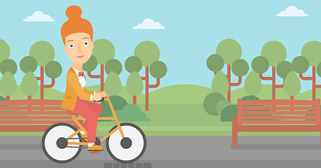 Image showing Woman riding bicycle.