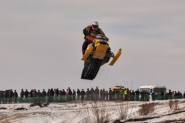 Image showing High jump of sportsman on snowmobile