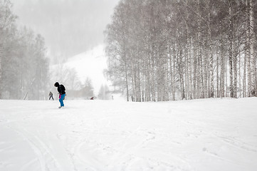 Image showing Woman doing exercise on snowboard