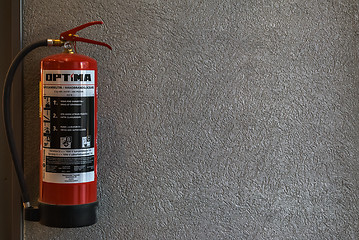 Image showing Fire extinguisher on the wall.