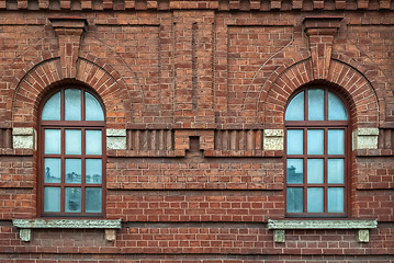 Image showing Two window on a brown wall.