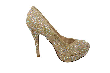 Image showing High heel gold shoe, covered in sparkling gems