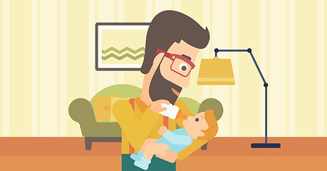 Image showing Man feeding baby.