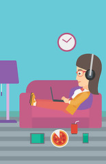 Image showing Woman lying on sofa with many gadgets.