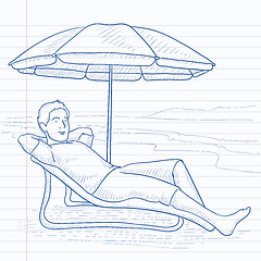 Image showing Man sitting in chaise longue.