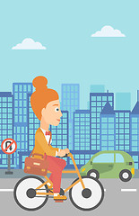 Image showing Woman cycling to work.