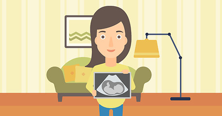 Image showing Pregnant woman with ultrasound image.