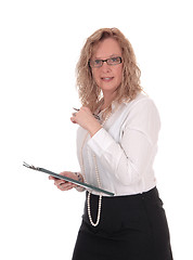 Image showing Business woman with glasses and clipboard. 
