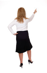 Image showing Business woman pointing up.