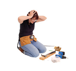 Image showing Woman confused what she did with tools.