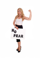 Image showing Blond woman holding sign NO FEAR.