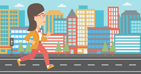 Image showing Sportive woman jogging.