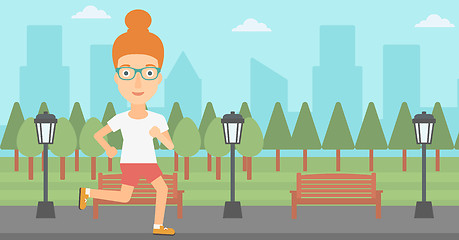 Image showing Sportive woman jogging.