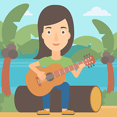 Image showing Woman playing guitar.