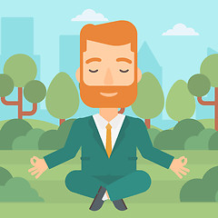 Image showing Businessman meditating in lotus pose.