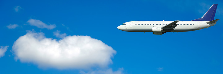 Image showing Air travel - Plane and cloud on blue sky