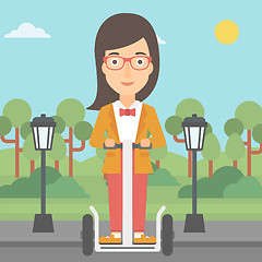 Image showing Woman riding on electric scooter.