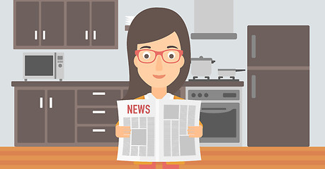 Image showing Woman reading newspaper.