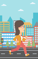 Image showing Sportive woman jogging.