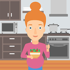 Image showing Pregnant woman eating salad.