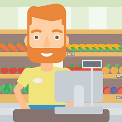 Image showing Salesman standing  at checkout.