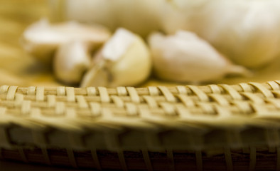 Image showing basket and garlics out of focus